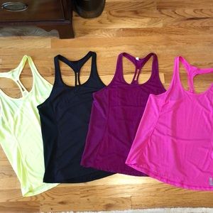 4 Under Armour Tank tops